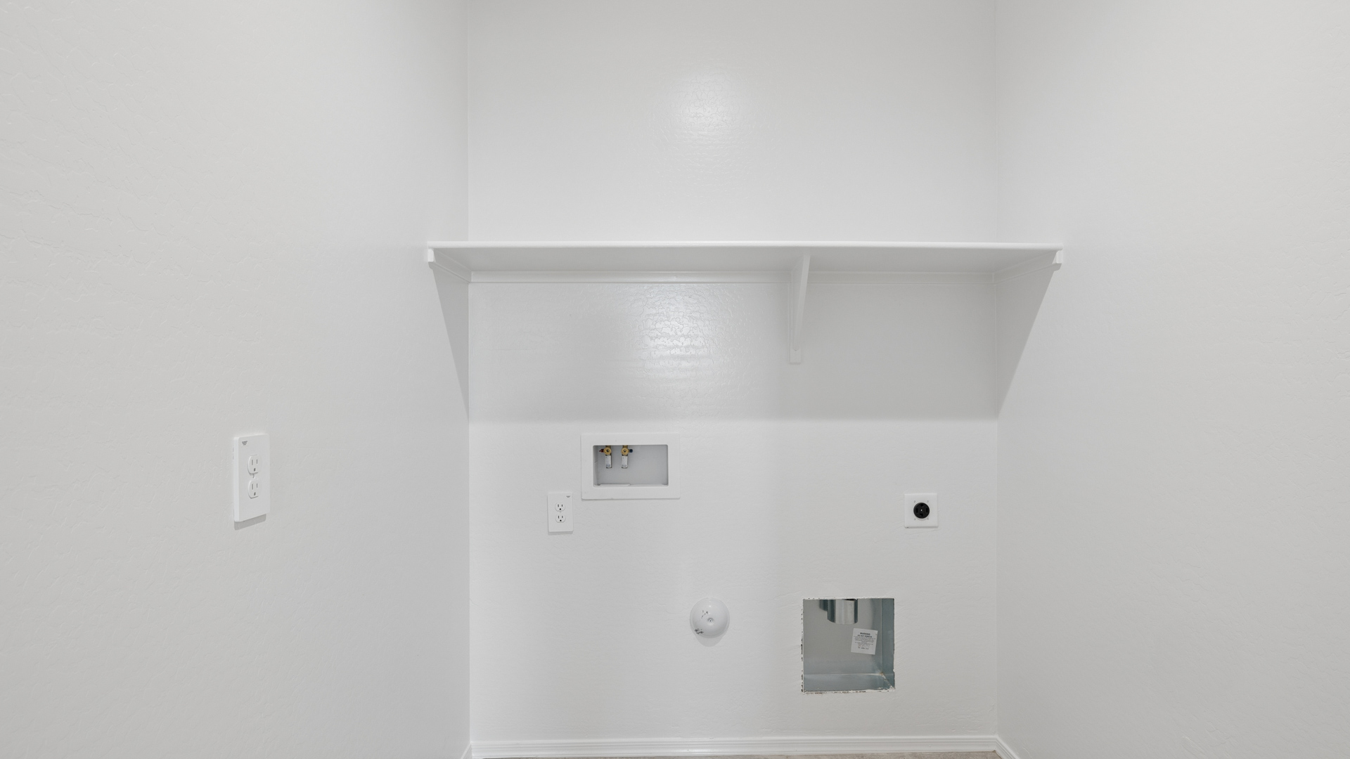 laundry room with shelving