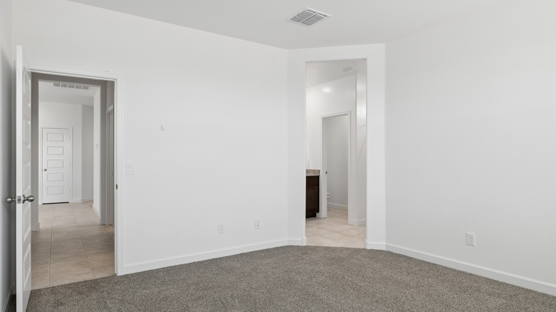 primary suite with walk in closet