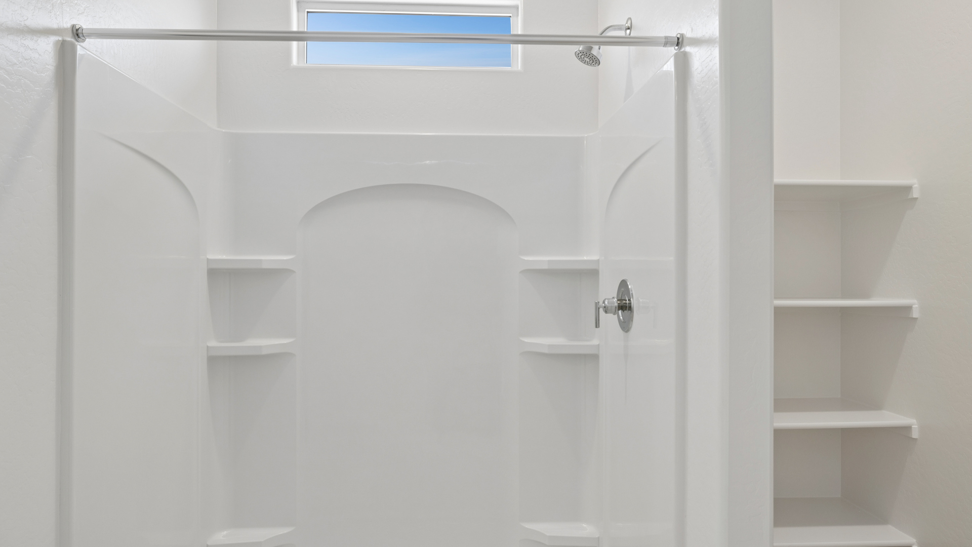 primary bathroom with dual vanities