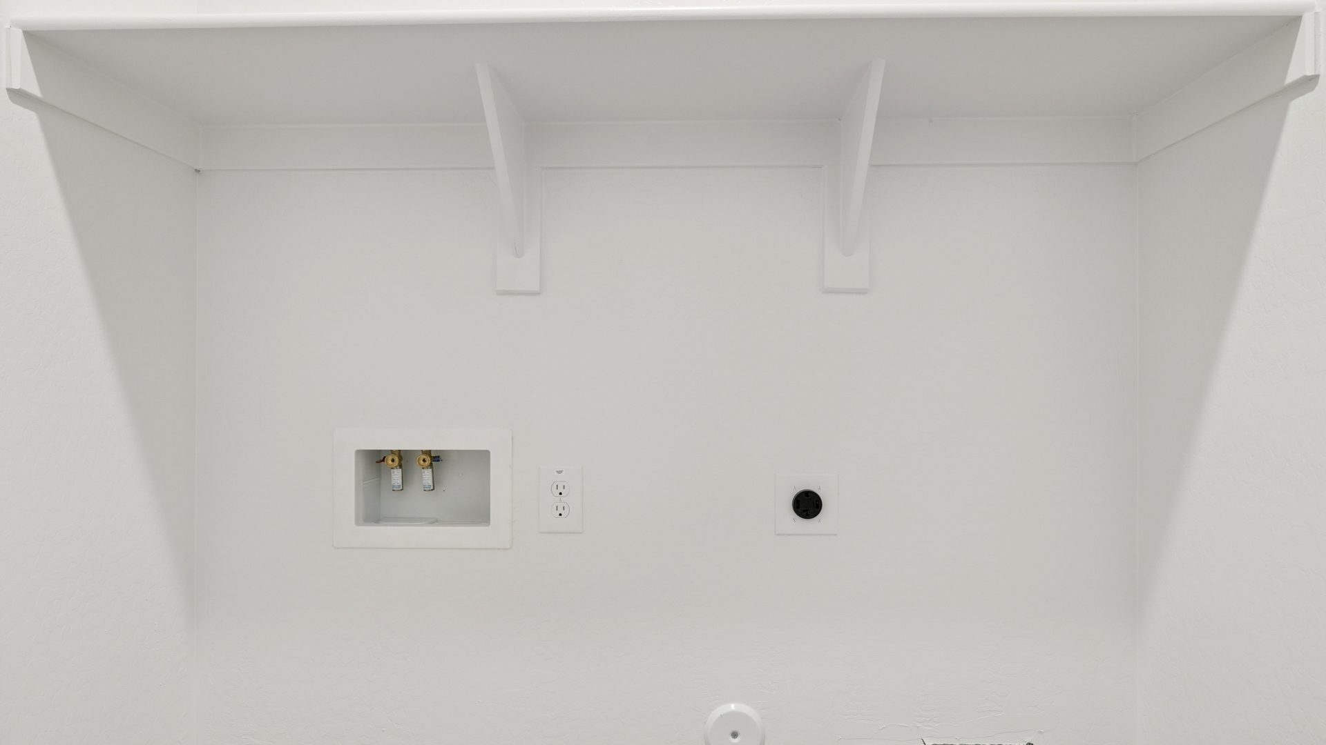 laundry room with shelving