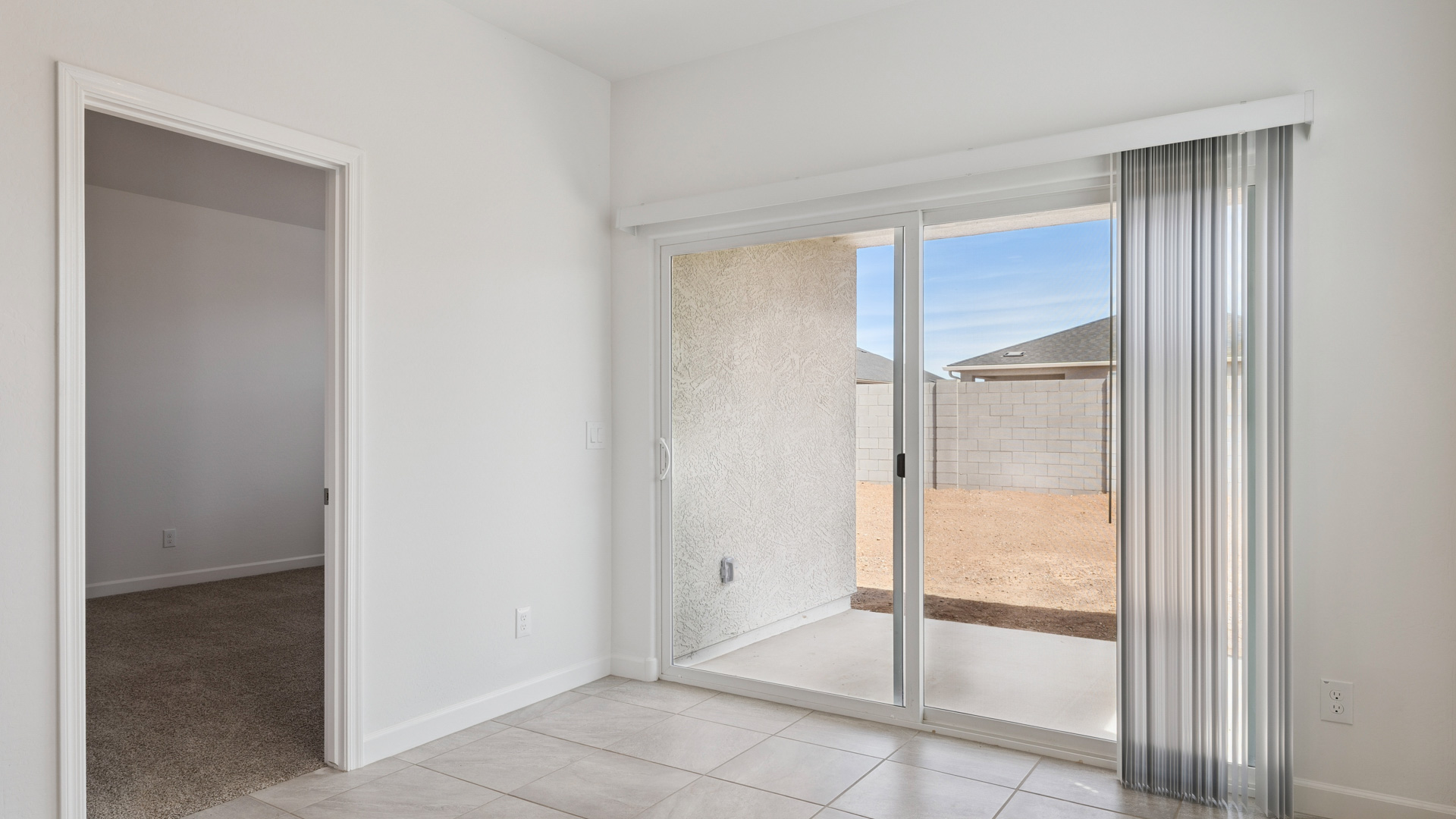 A well-organized living room that includes a kitchen and dining area, creating a warm and welcoming environment for gatherings.