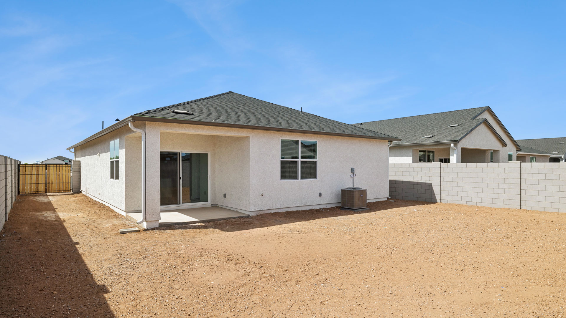 Large fenced-in backyard with a covered patio, perfect for outdoor entertainment.