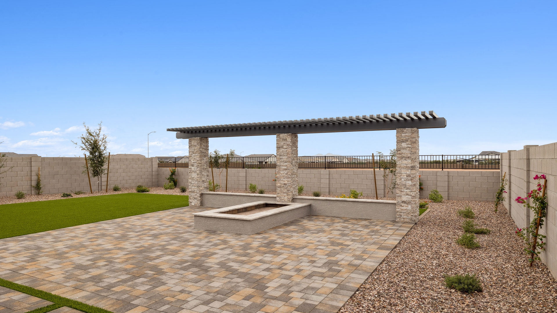 Large fenced-in backyard with a covered patio, perfect for outdoor entertainment.