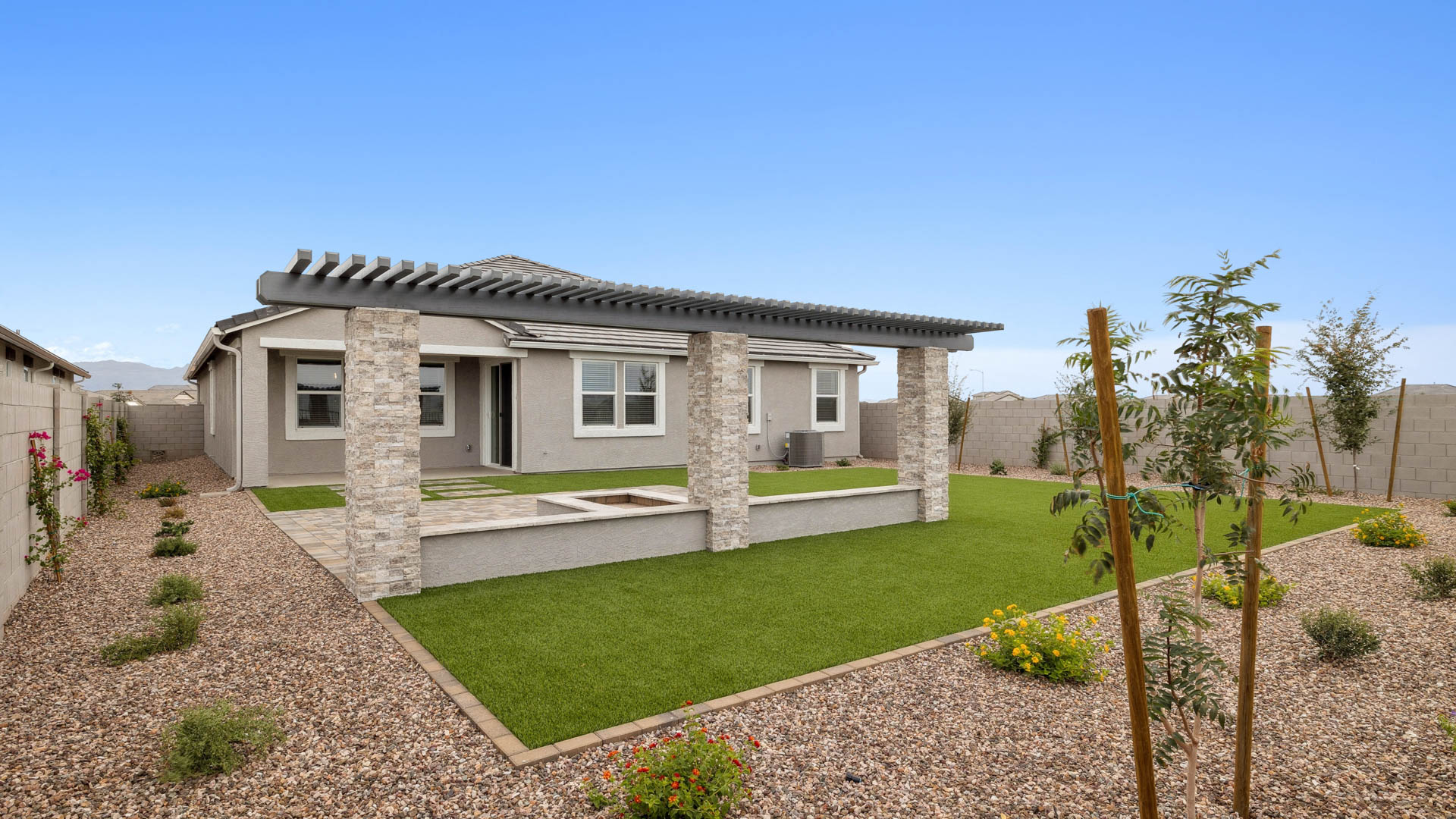 Large fenced-in backyard with a covered patio, perfect for outdoor entertainment.