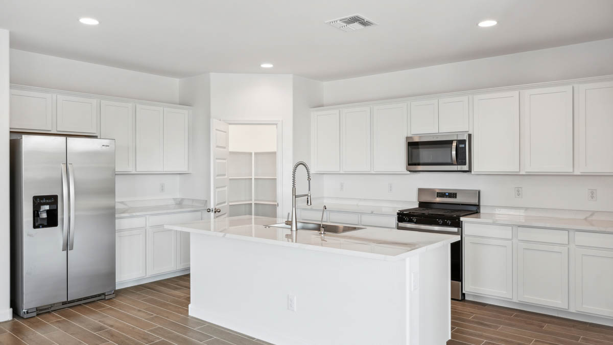 spacious kitchen with large island and pantry