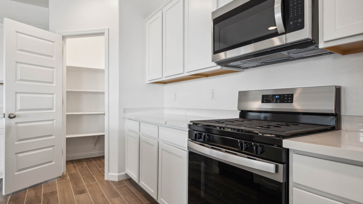 spacious kitchen with large island and pantry