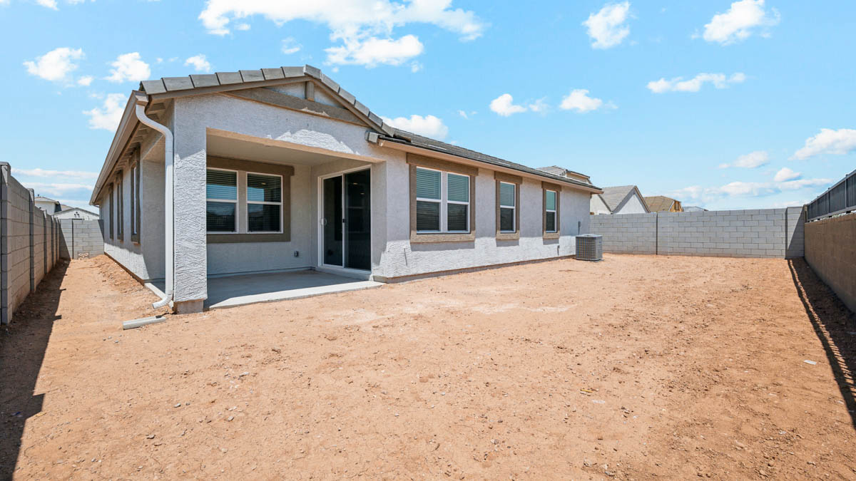 back of new home with covered patio