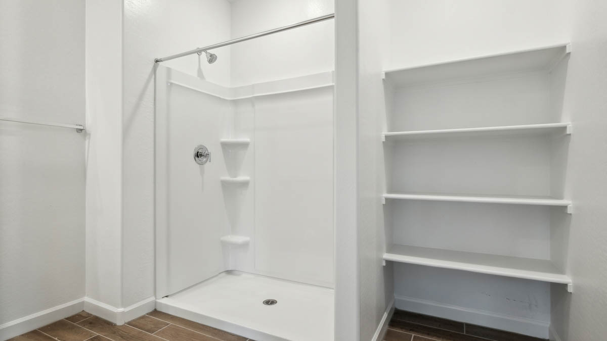 primary bathroom with dual vanities