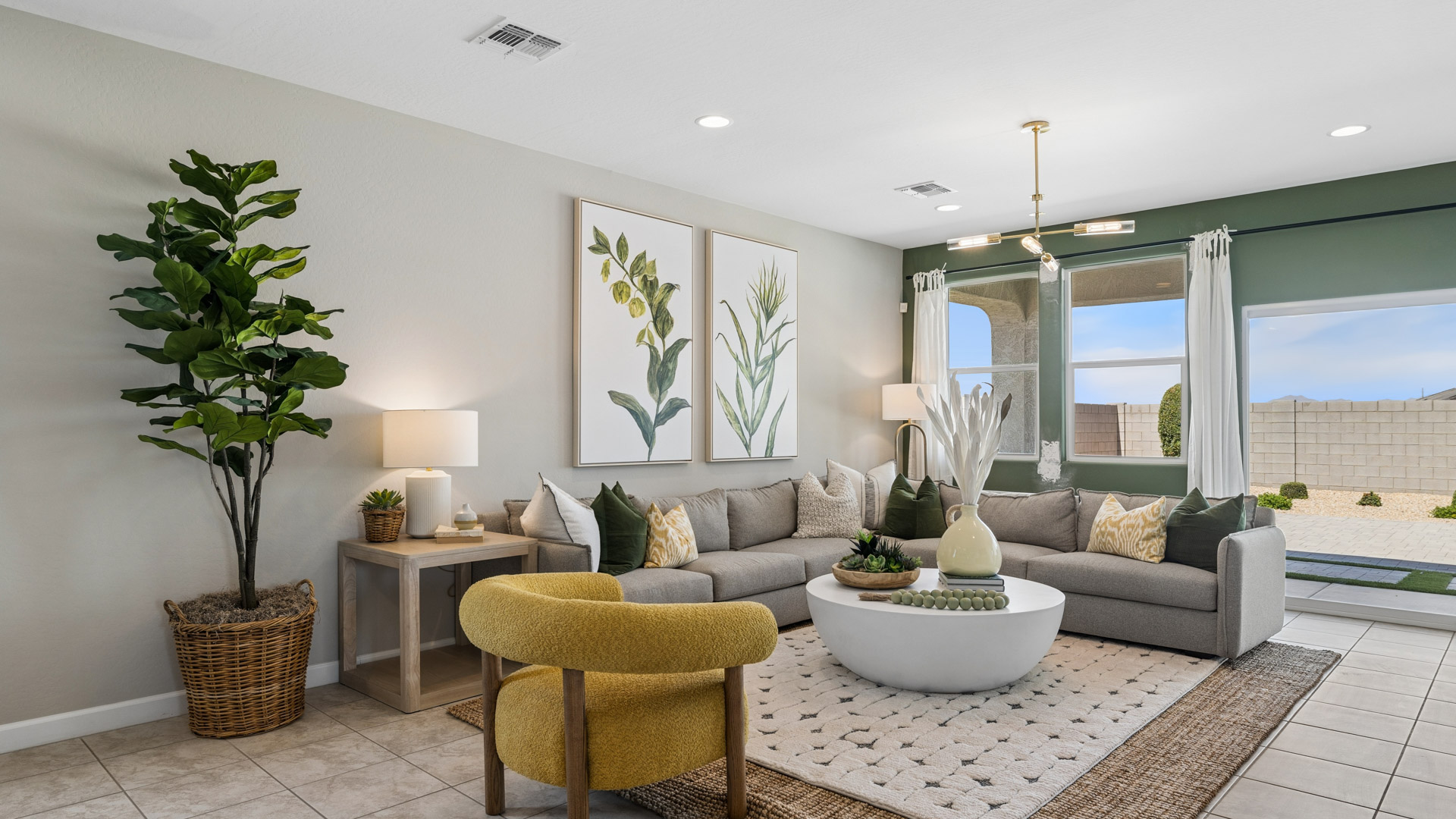 A well-organized living room that includes a kitchen and dining area, creating a warm and welcoming environment for gatherings.