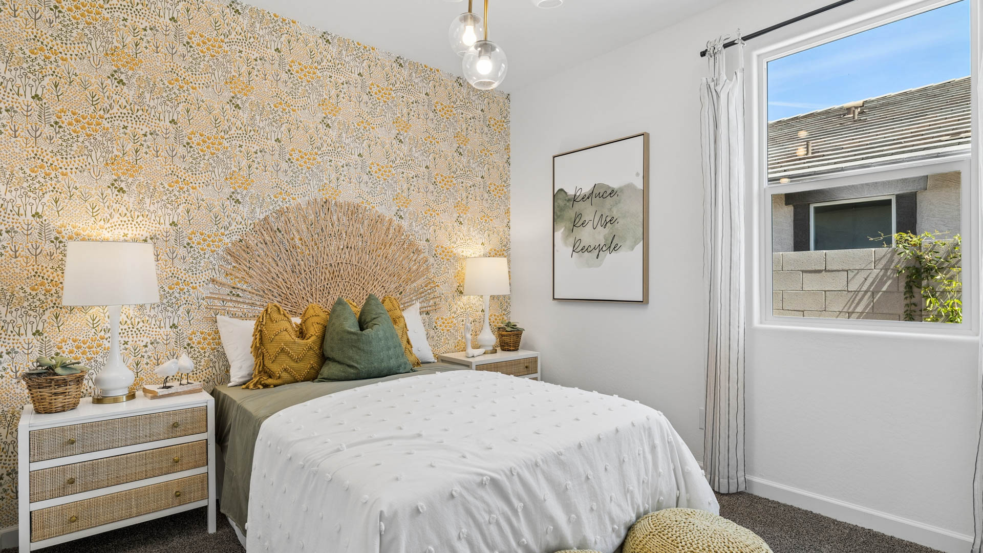 Comfortable guest bedroom featuring neutral-toned walls and a large closet.