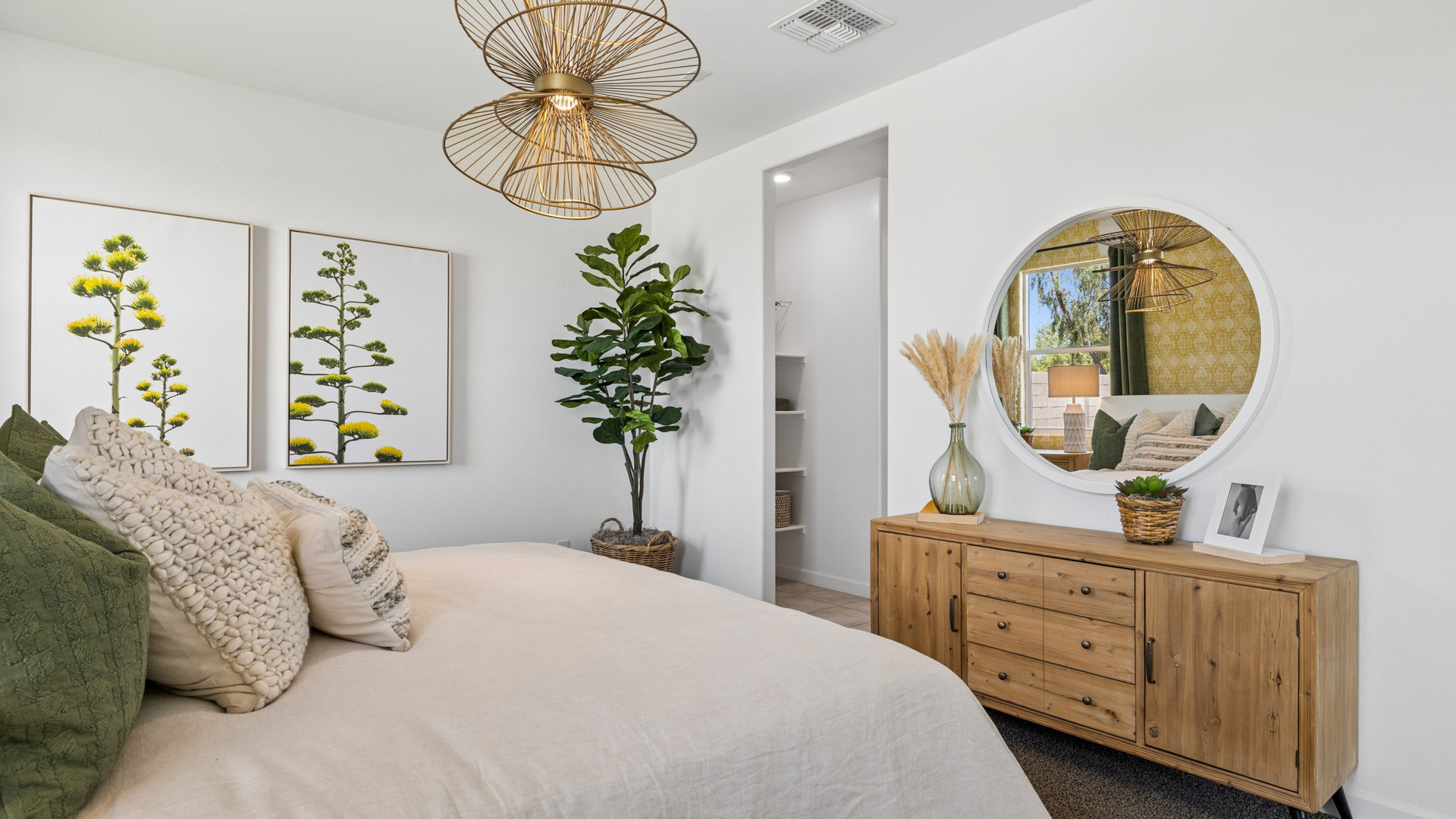 Comfortable guest bedroom featuring neutral-toned walls and a large closet.