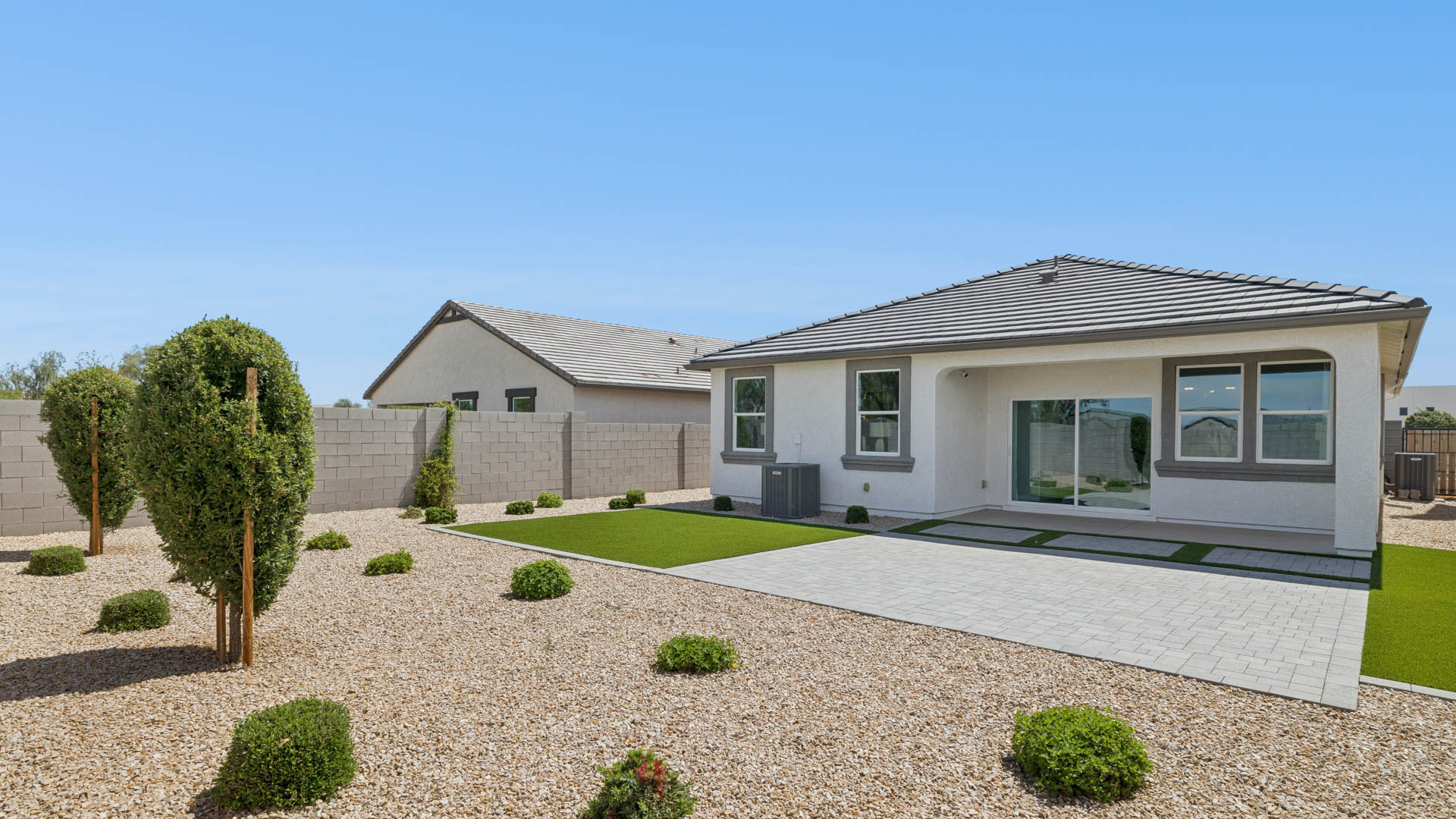 Large fenced-in backyard with a covered patio, perfect for outdoor entertainment.