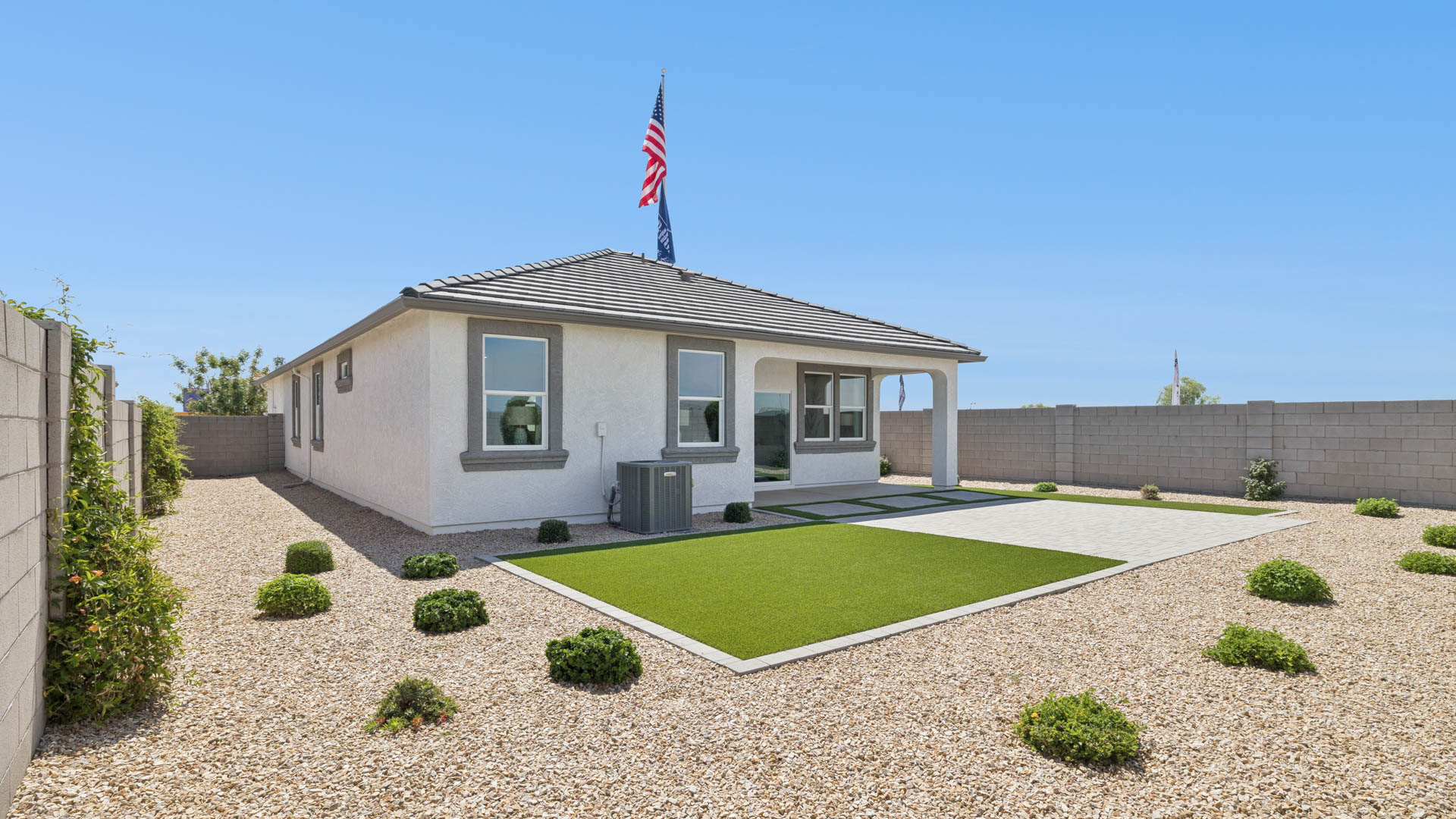 Large fenced-in backyard with a covered patio, perfect for outdoor entertainment.