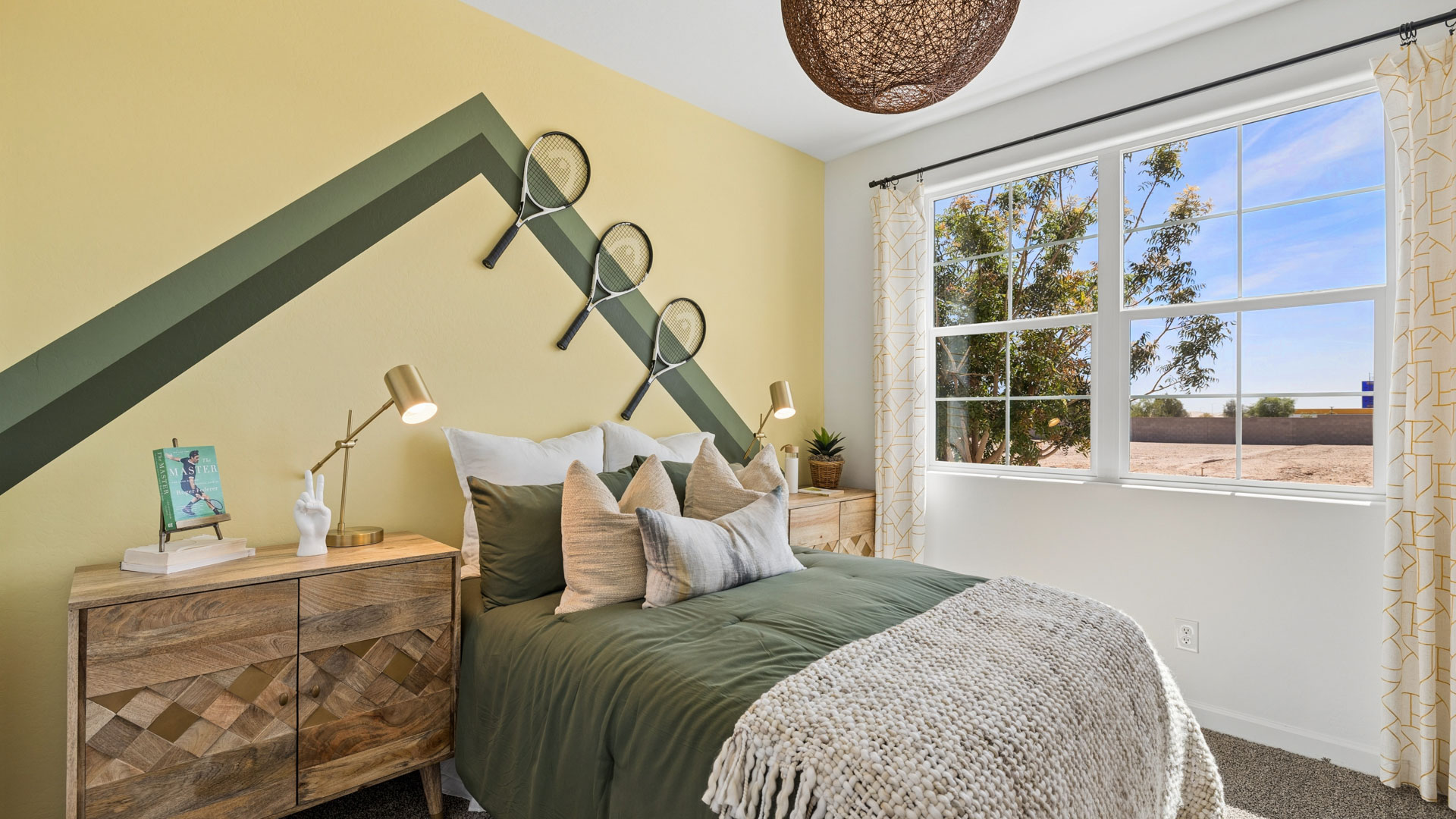 Comfortable guest bedroom featuring neutral-toned walls and a large closet.