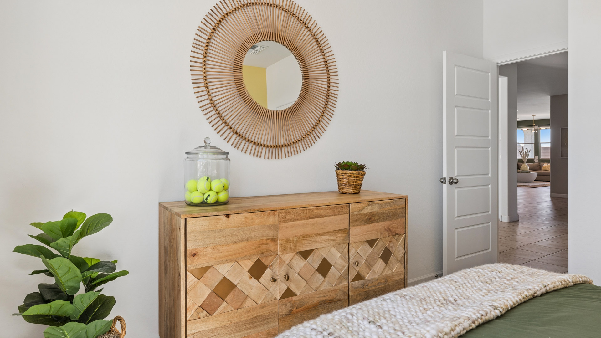 Comfortable guest bedroom featuring neutral-toned walls and a large closet.