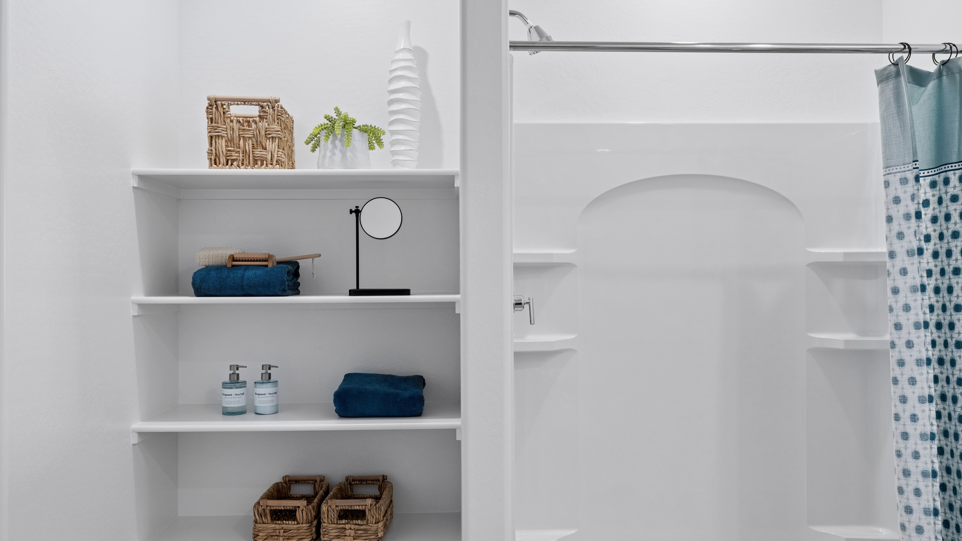 primary bathroom with dual vanities