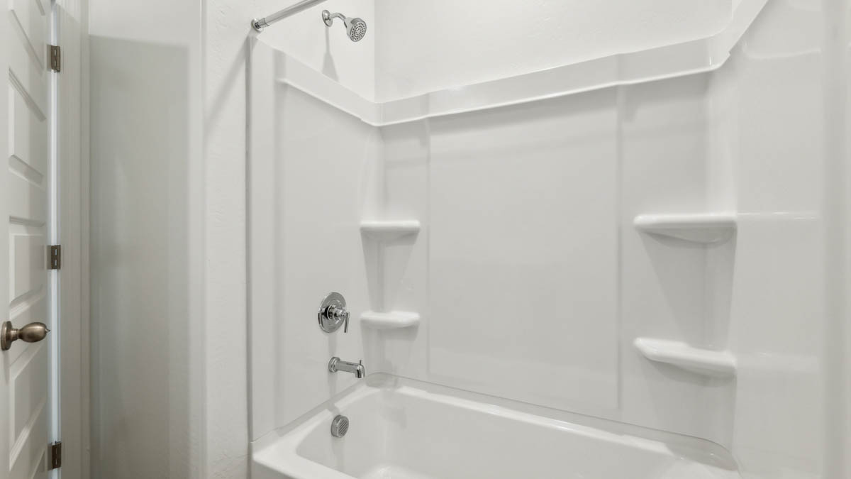 Guest bathroom with one sink, shower, and a toilet.