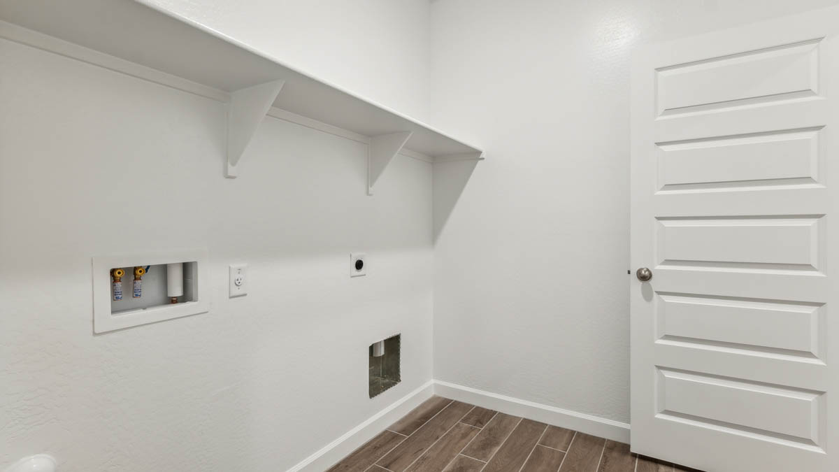 Laundry room with shelving.