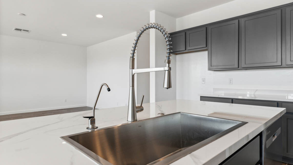Kitchen sink with ample cabinet and counter space.