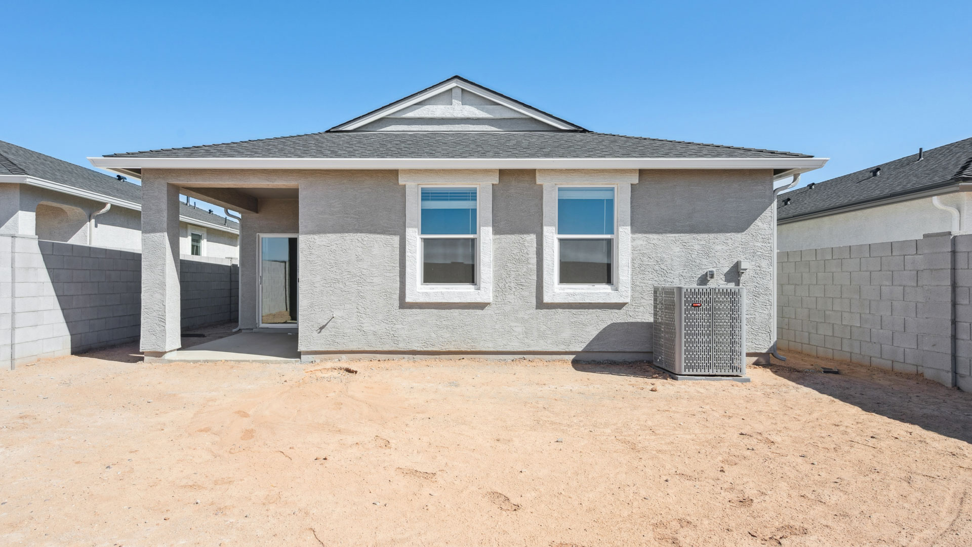 Large fenced-in backyard with a covered patio, perfect for outdoor entertainment.