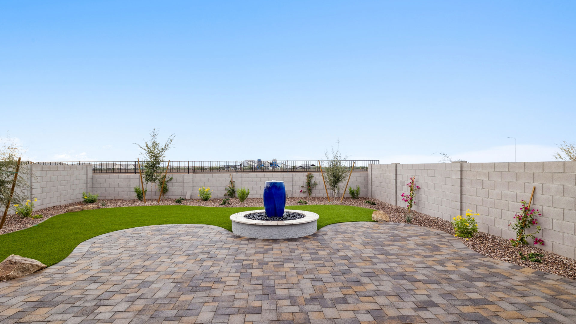 Large fenced-in backyard with a covered patio, perfect for outdoor entertaining.