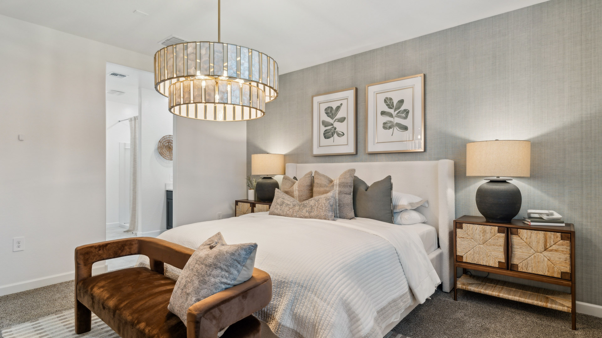 Primary bedroom with plush carpeting and a large walk-in closet.