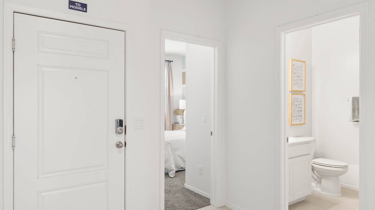 Entry hallway leading to bedrooms in the background.