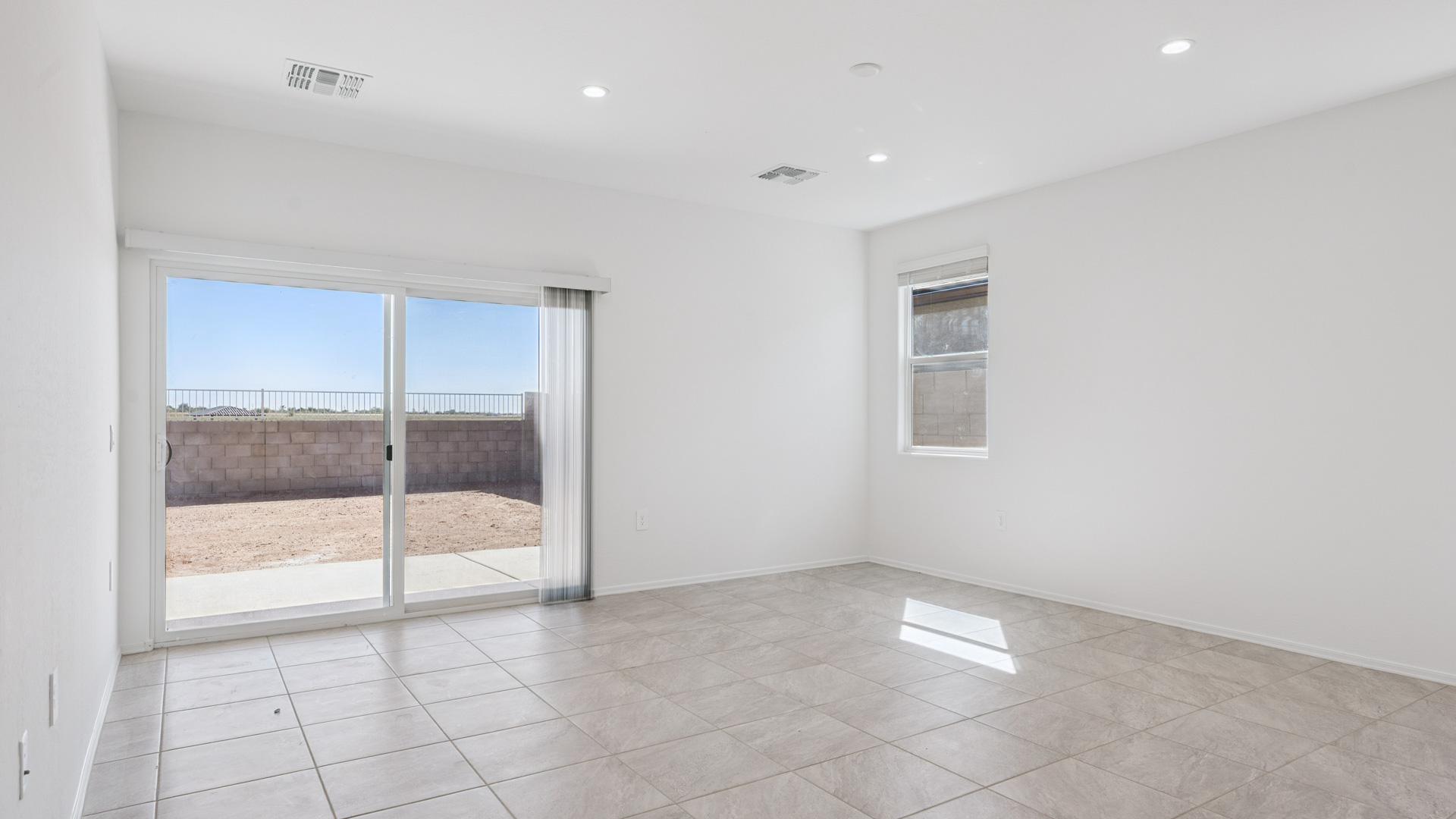 A well-organized living room that includes a kitchen and dining area, creating a warm and welcoming environment for gatherings.