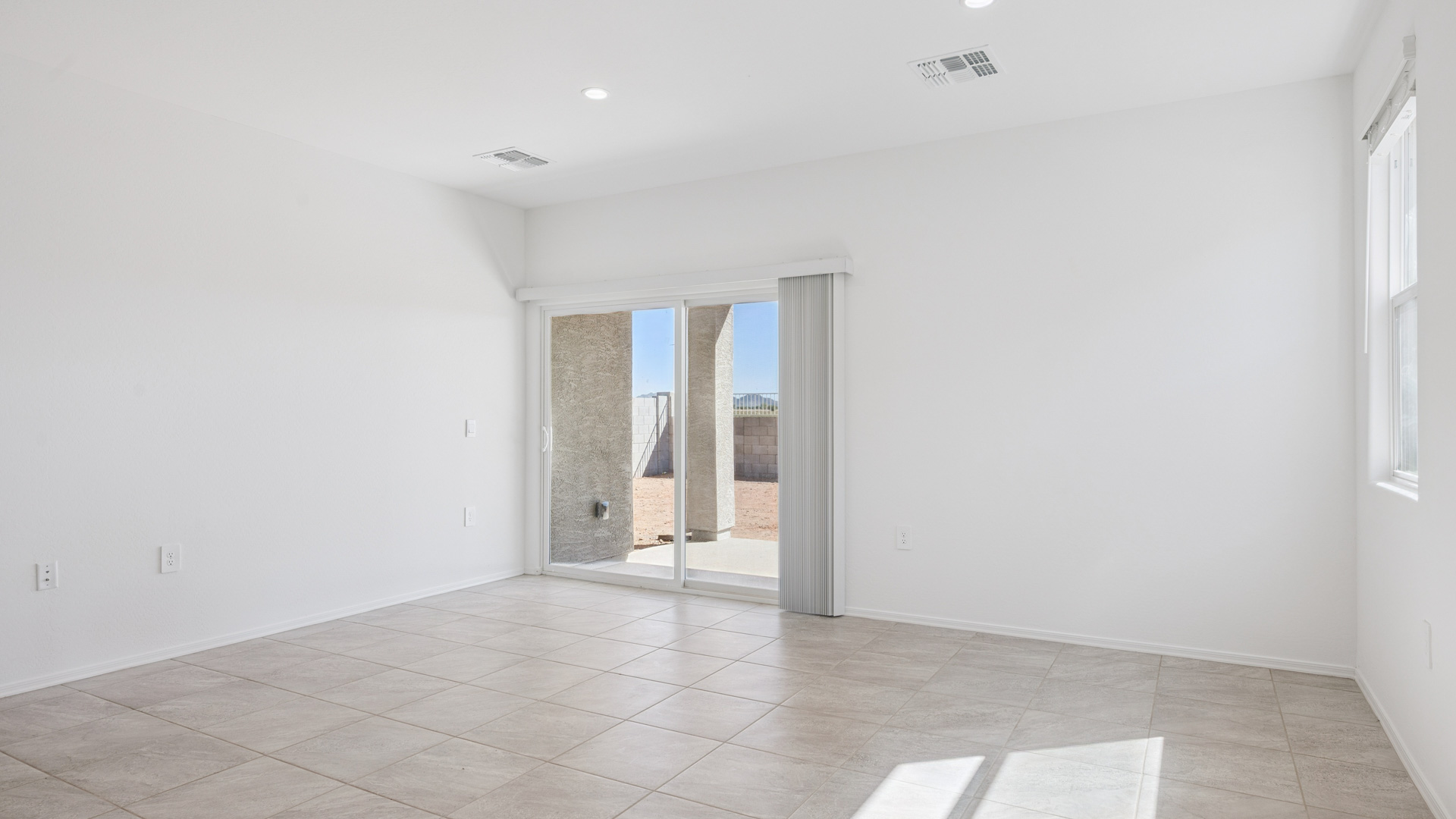 A well-organized living room that includes a kitchen and dining area, creating a warm and welcoming environment for gatherings.