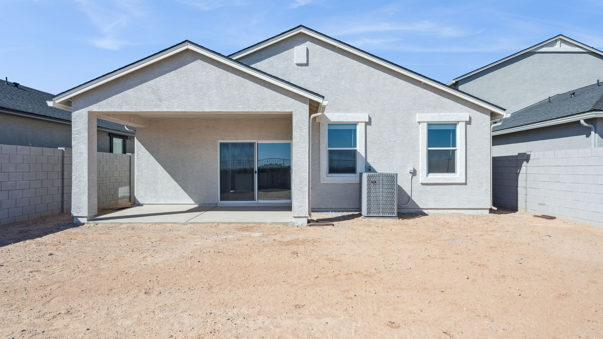 Large fenced-in backyard with a covered patio, perfect for outdoor entertaining.