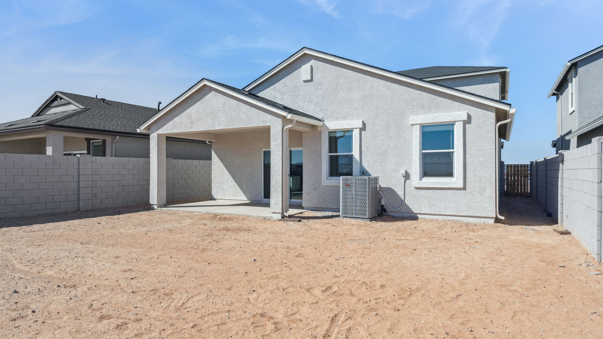 Large fenced-in backyard with a covered patio, perfect for outdoor entertaining. Large fenced-in backyard with a covered patio, perfect for outdoor entertaining.
