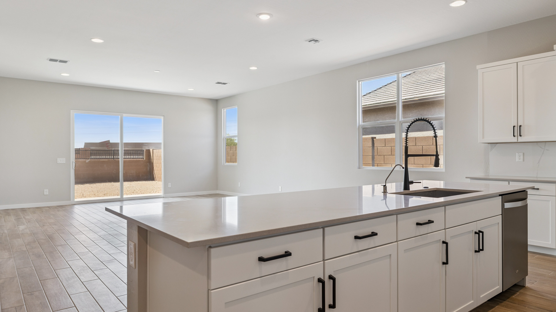 spacious kitchen with large island and walk in pantry