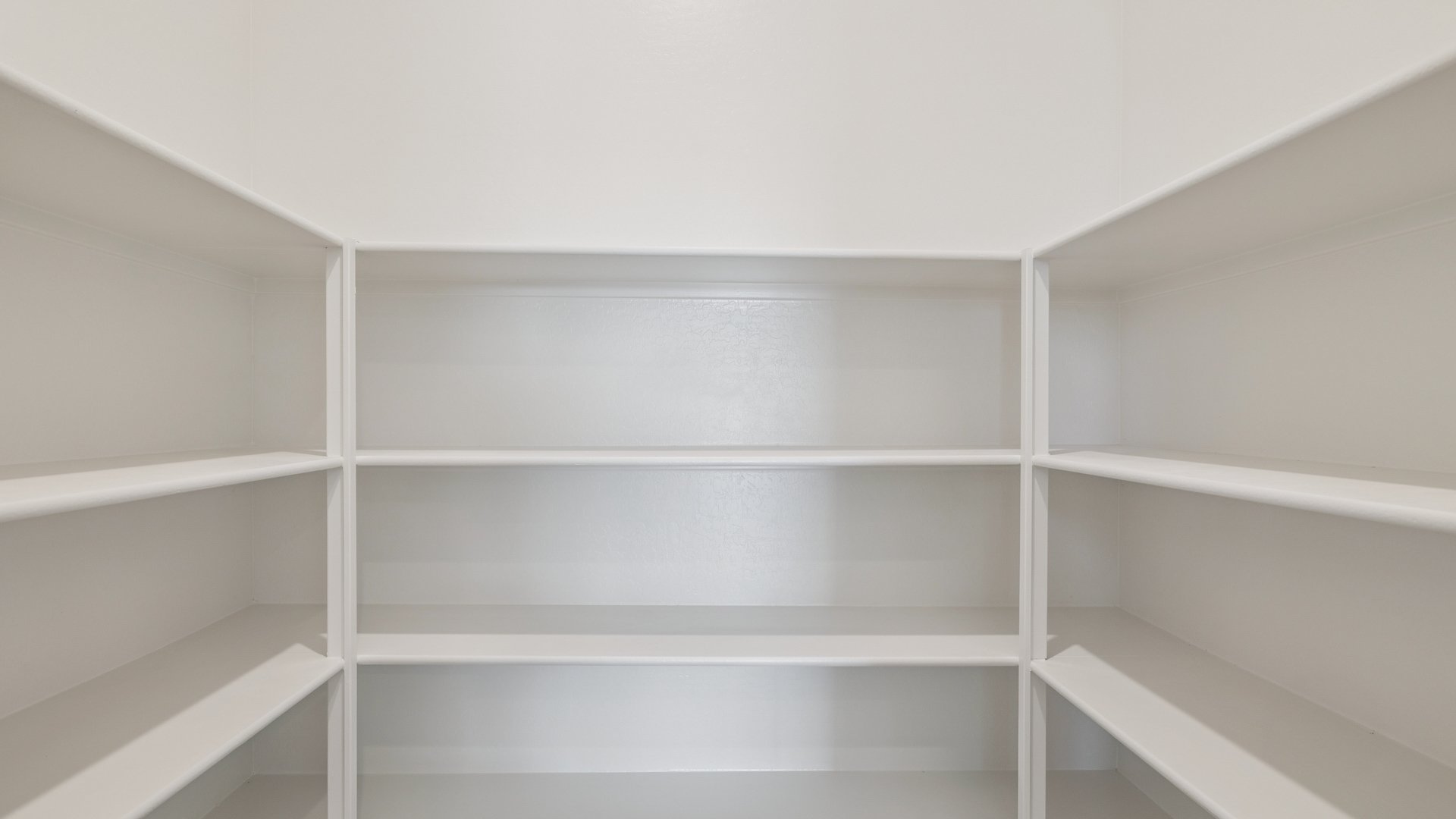 spacious kitchen with large island and walk in pantry