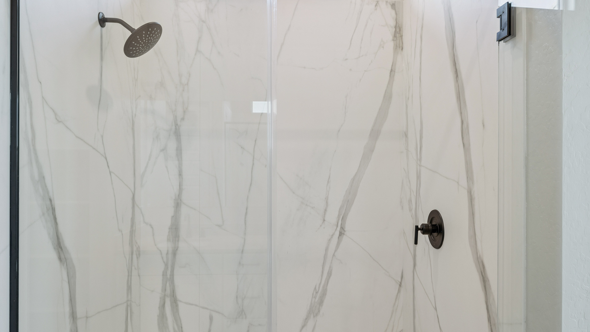 primary bathroom with dual vanities