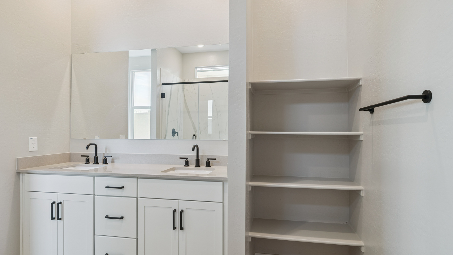 primary bathroom with dual vanities
