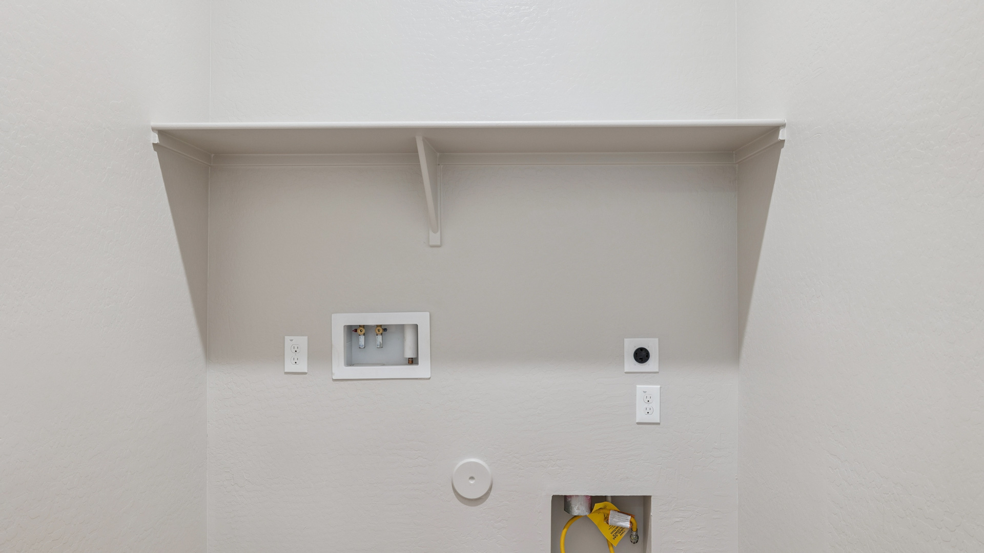laundry room with shelving