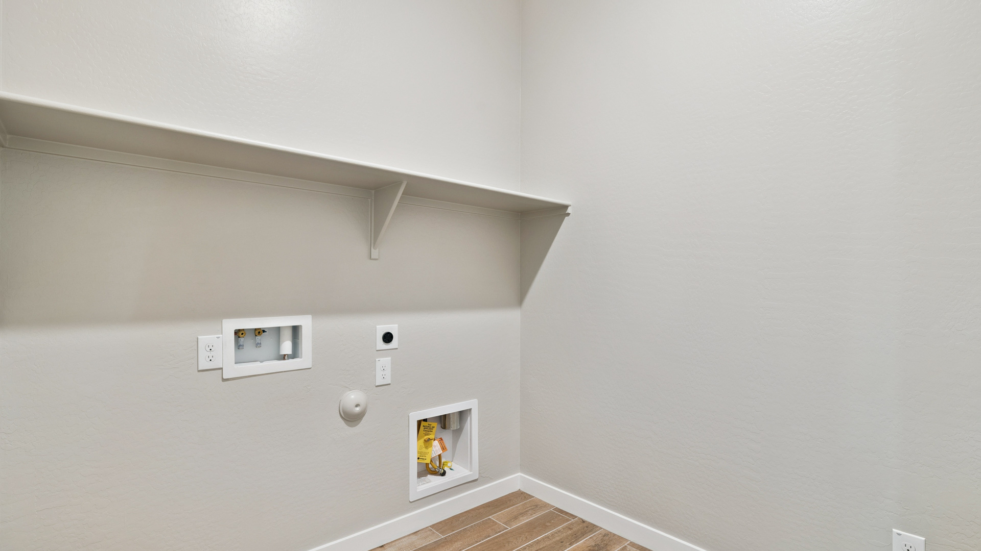 laundry room with shelving