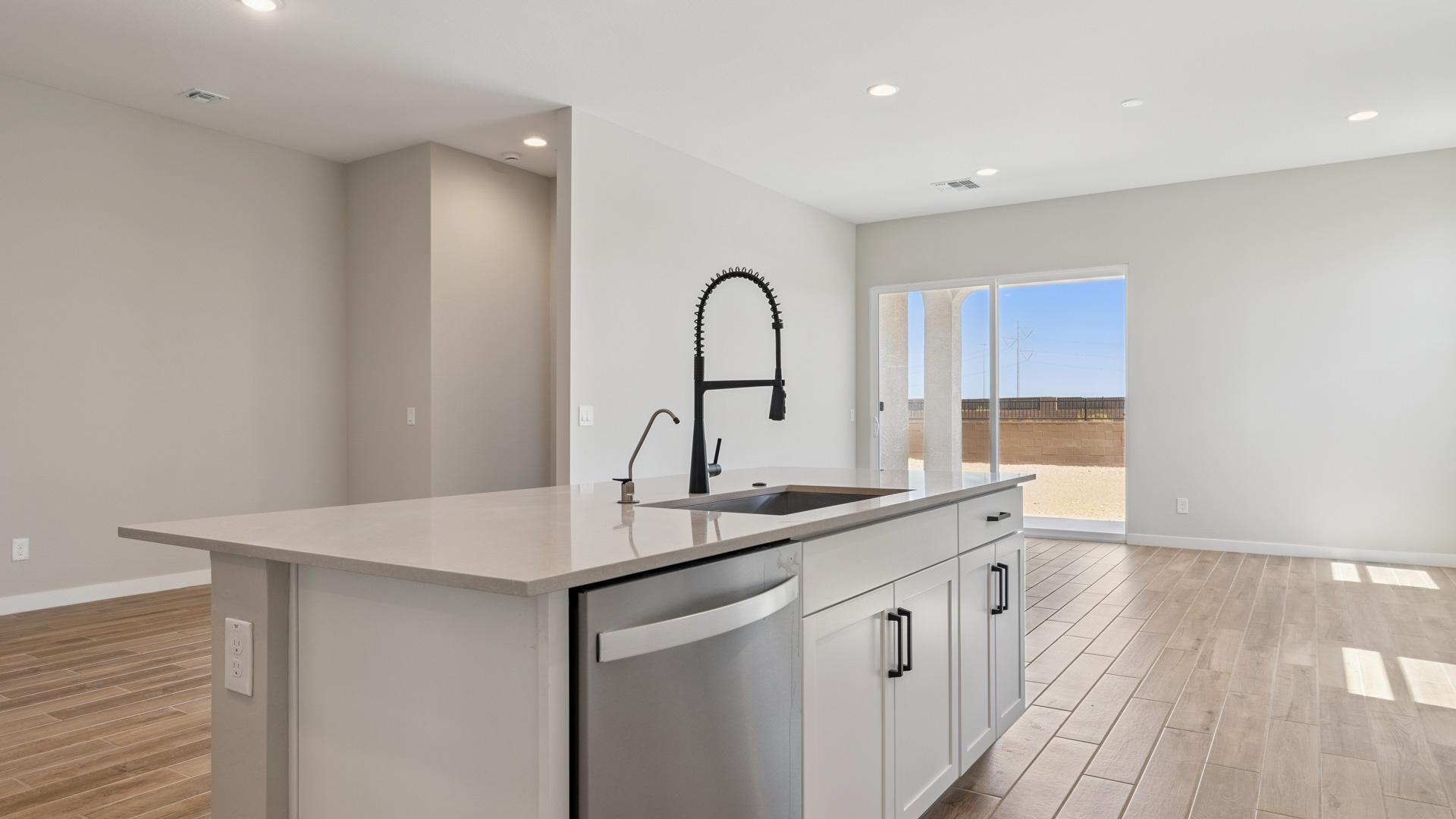 spacious kitchen with large island and walk in pantry