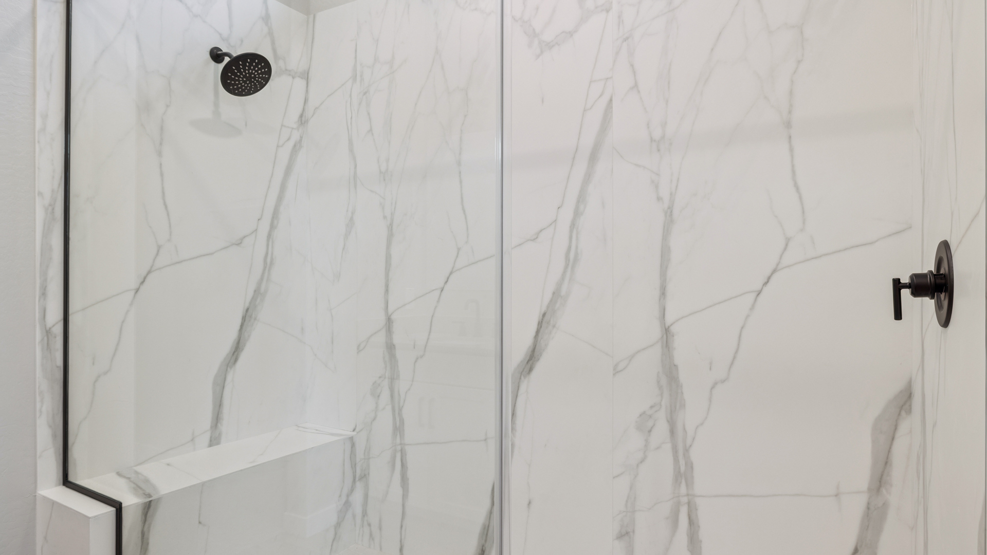 primary bathroom with dual vanities