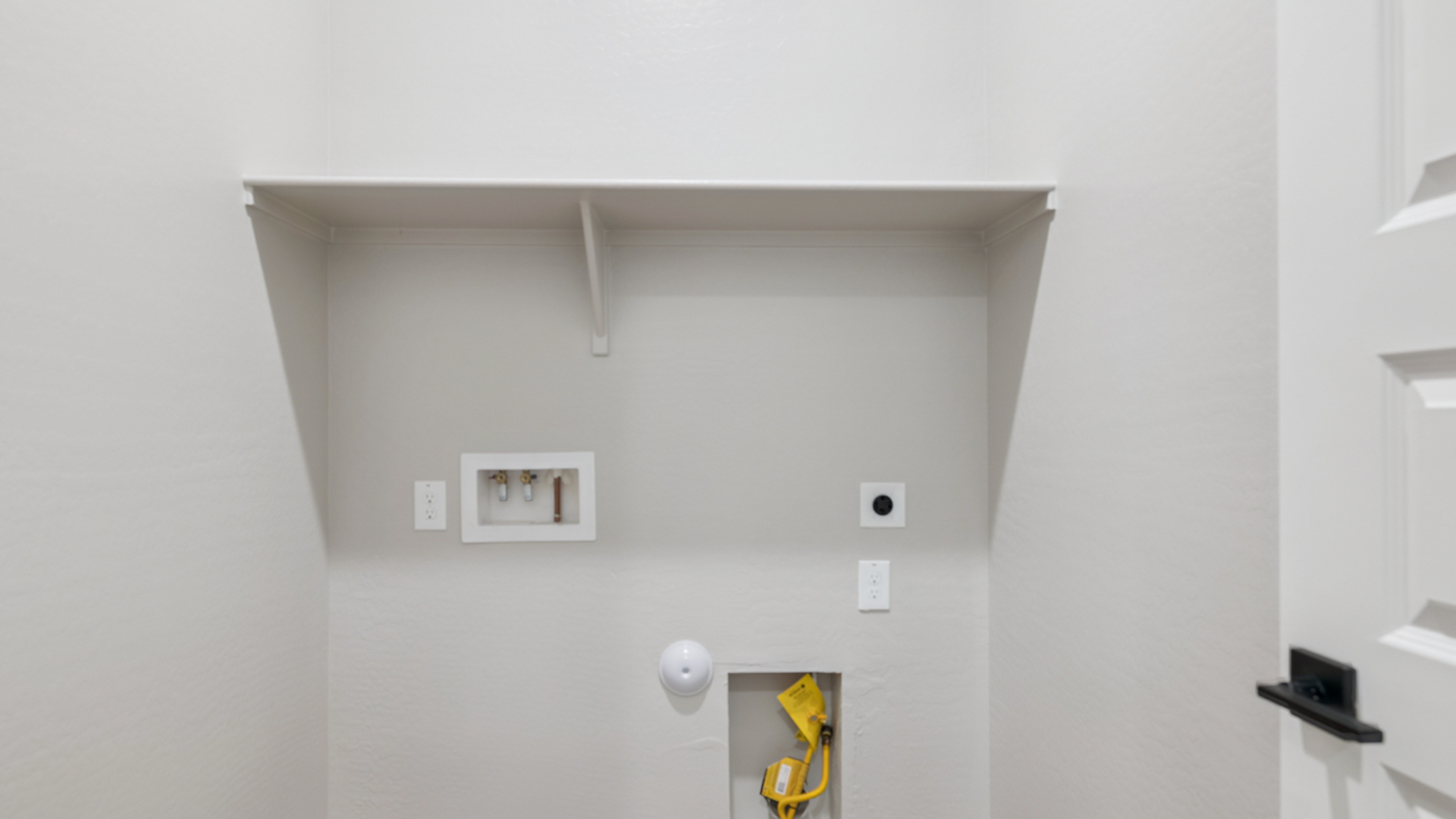 laundry room with shelving