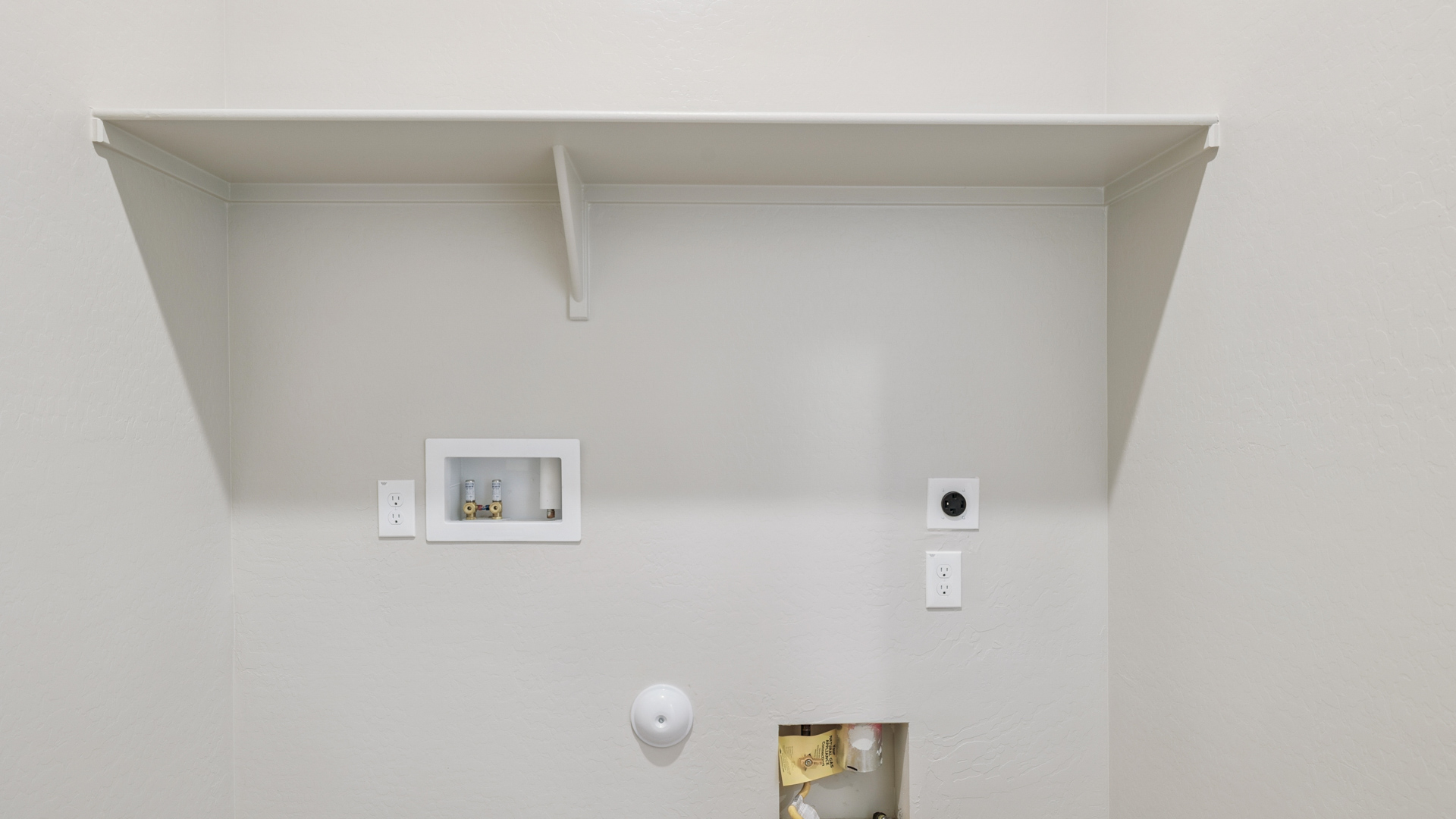 laundry room with shelving