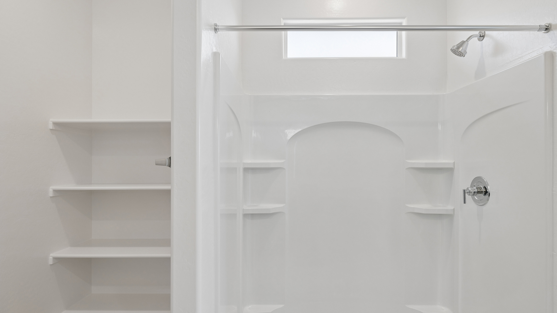 primary bathroom with dual vanities