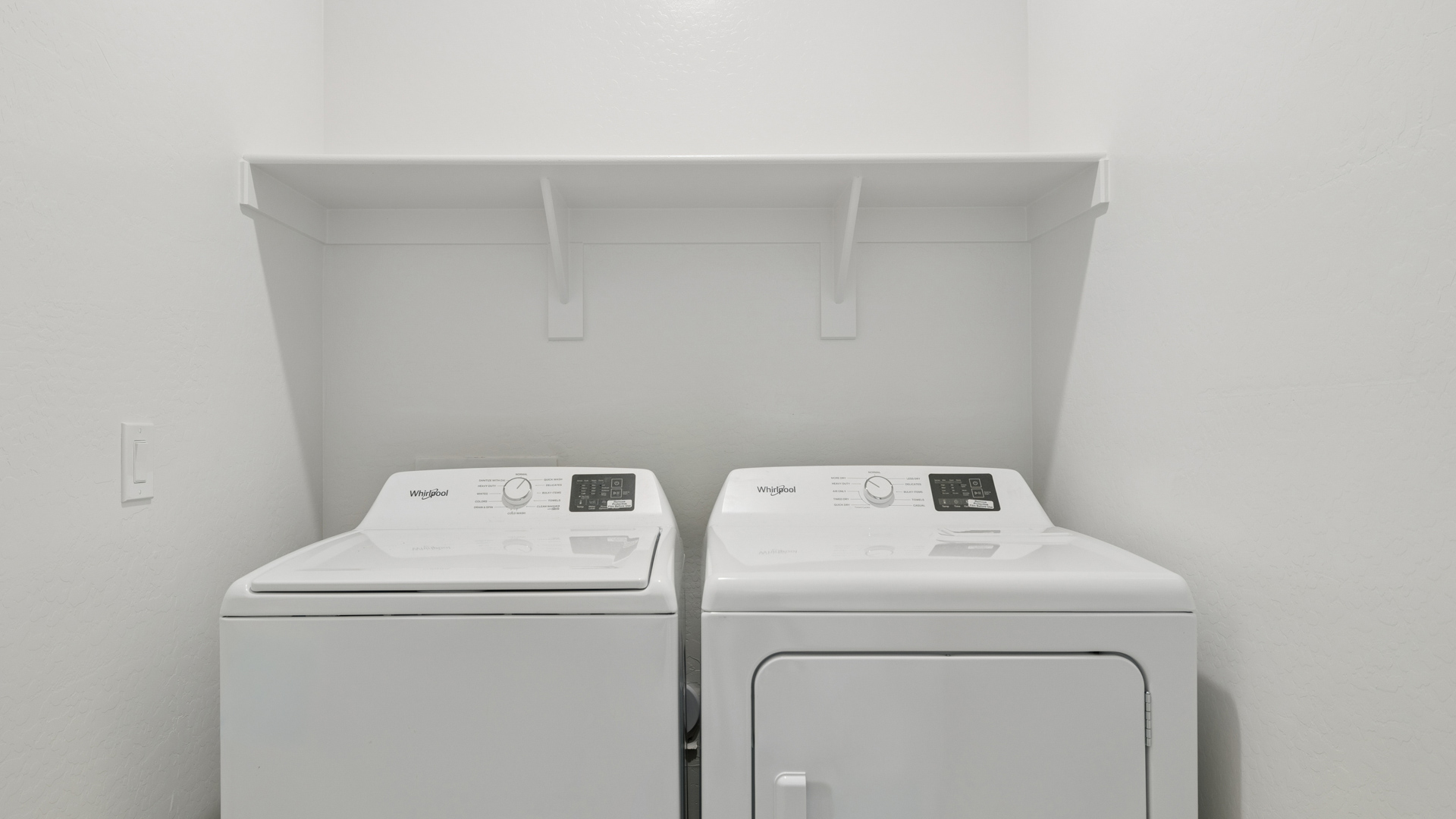 laundry room with shelving