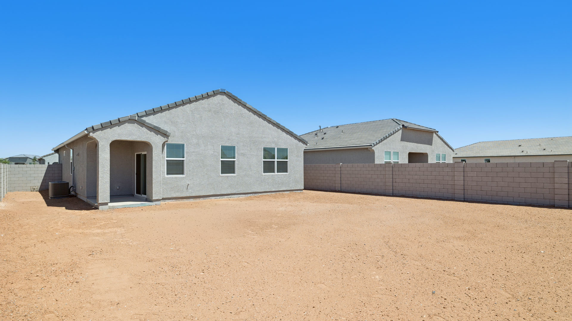 back of new home with covered patio