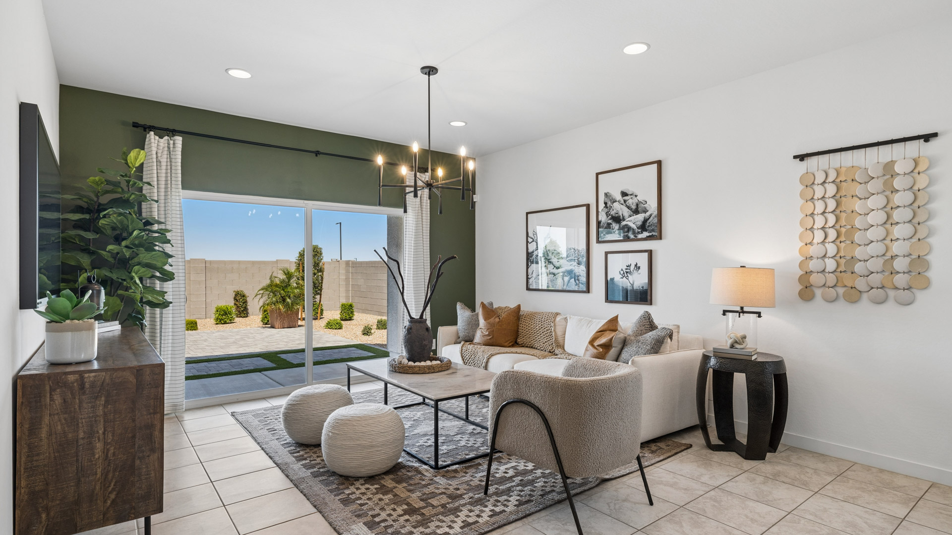 A well-organized living room that includes a kitchen and dining area, creating a warm and welcoming environment for gatherings.