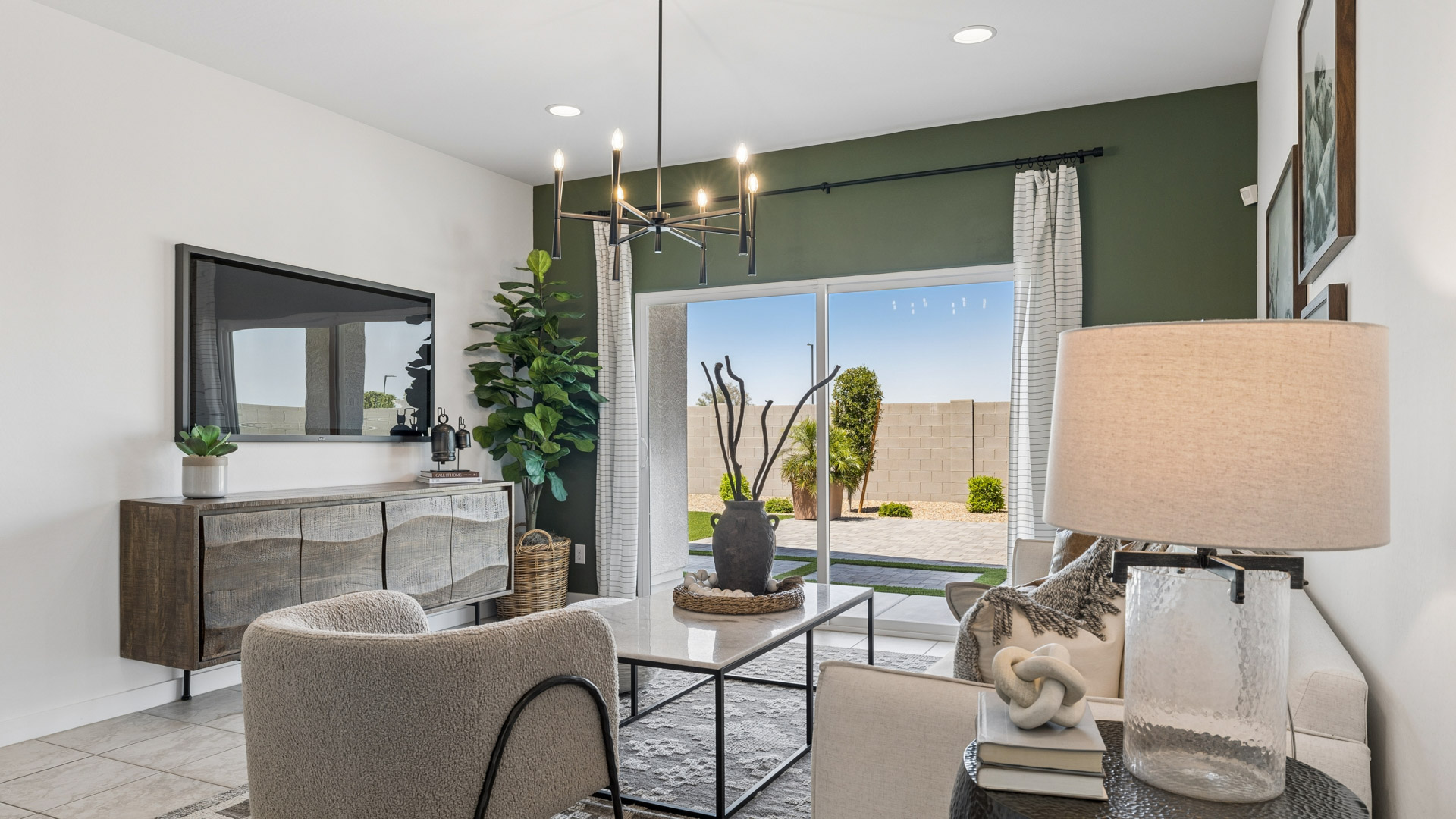 A well-organized living room that includes a kitchen and dining area, creating a warm and welcoming environment for gatherings.