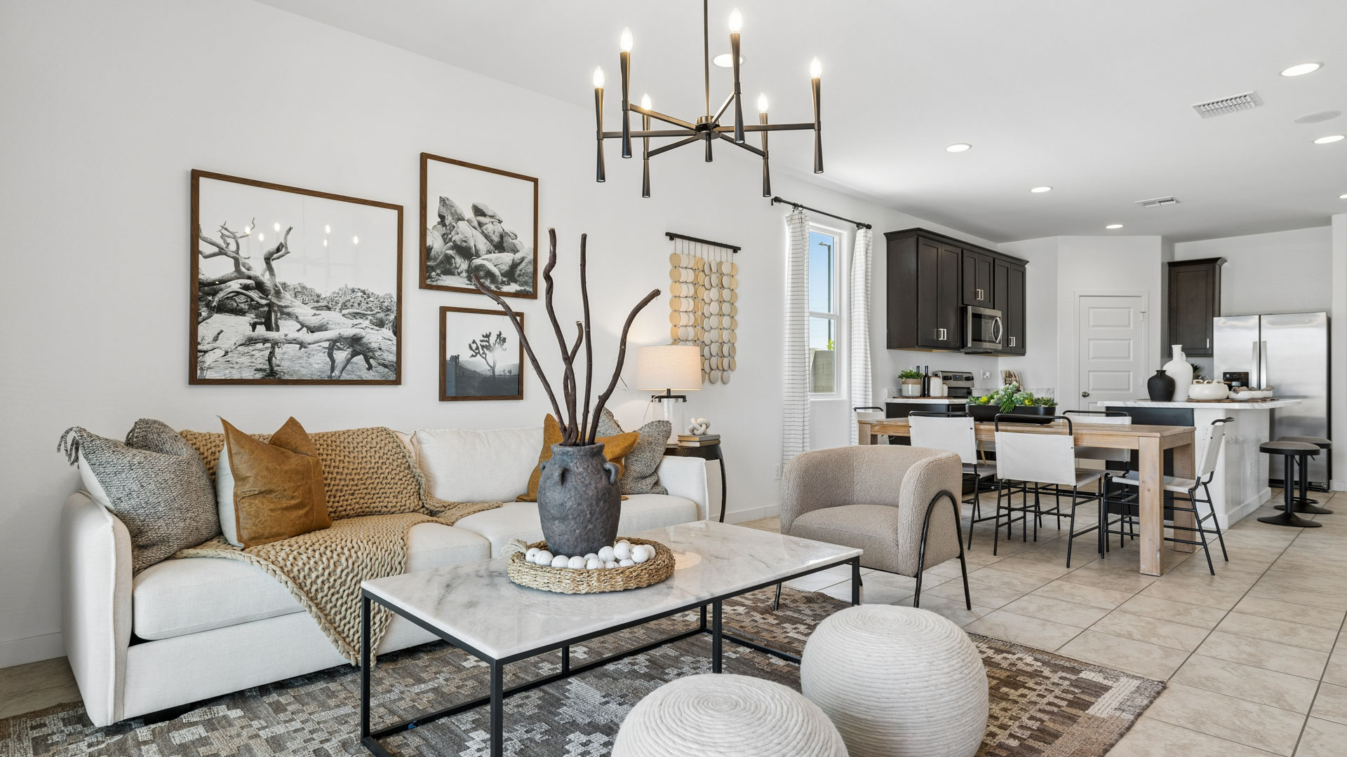 A well-organized living room that includes a kitchen and dining area, creating a warm and welcoming environment for gatherings.