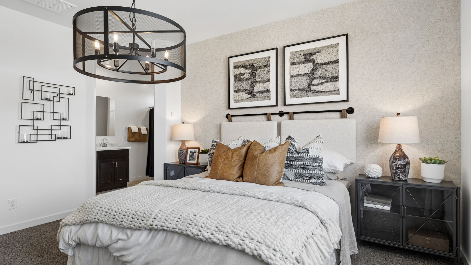 A spacious primary bedroom emphasizing open space and natural lighting.