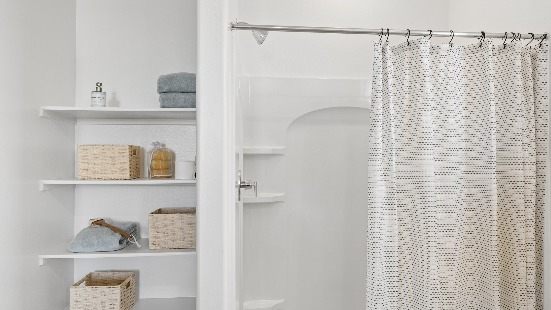 primary bathroom with dual vanities