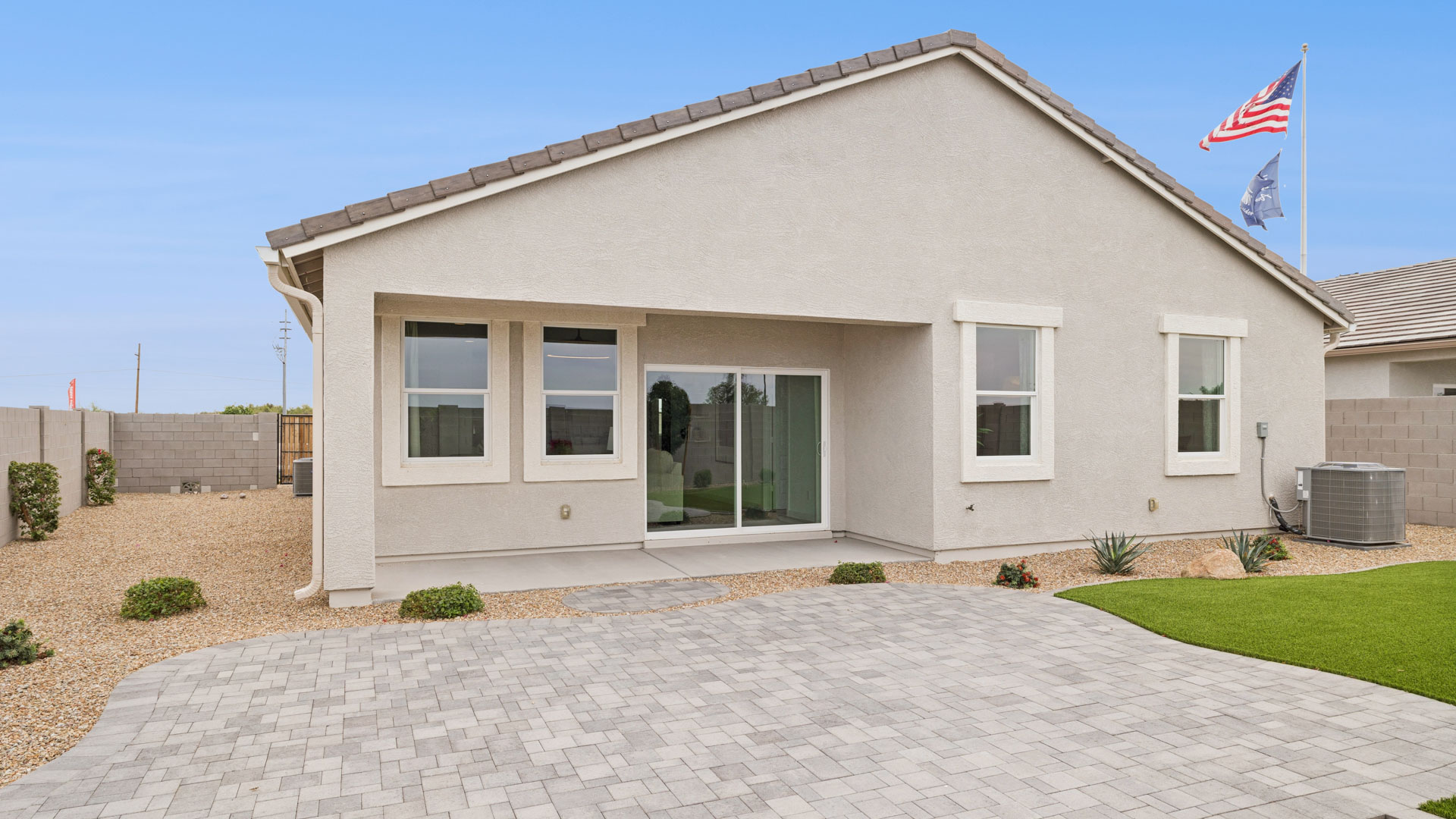 Large fenced-in backyard with a covered patio, perfect for outdoor entertaining.